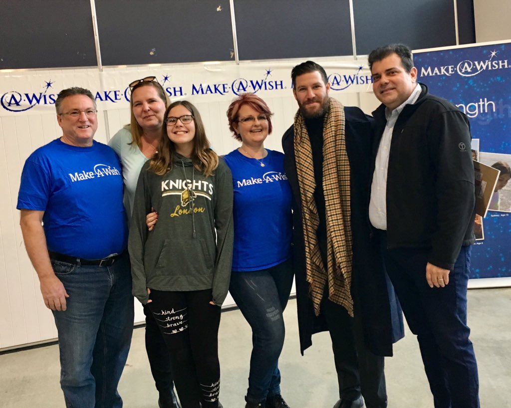 (From left to right) Make-A-Wish Southwestern Ontario volunteer wish granter Wayne Harvey, Debbie Pires, Samantha Pires, Make-A-Wish Southwestern Ontario volunteer wish granter Jen Harvey, former NHL player Brandon Prust and Nelson Pires pose for a group photo following the Make-A-Wish Southwestern Ontario wish reveal at Covent Garden Market on Monday, Dec. 17, 2018. 