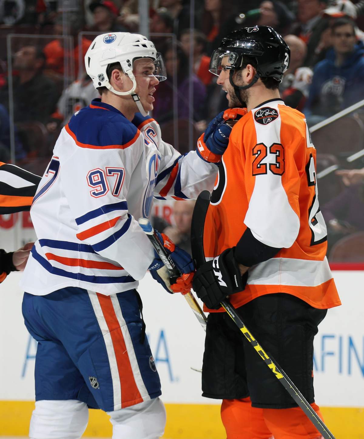  Brandon Manning #23 of the Philadelphia Flyers scuffles with Connor McDavid #97 of the Edmonton Oilers in the second period on December 8, 2016 at the Wells Fargo Center in Philadelphia, Pennsylvania. (Photo by Len Redkoles/NHLI via Getty Images)