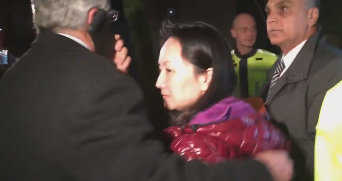 Meng Wanzhou is led into a Cadillac Escalade after she was released from custody following a bail hearing on Dec. 11, 2018.