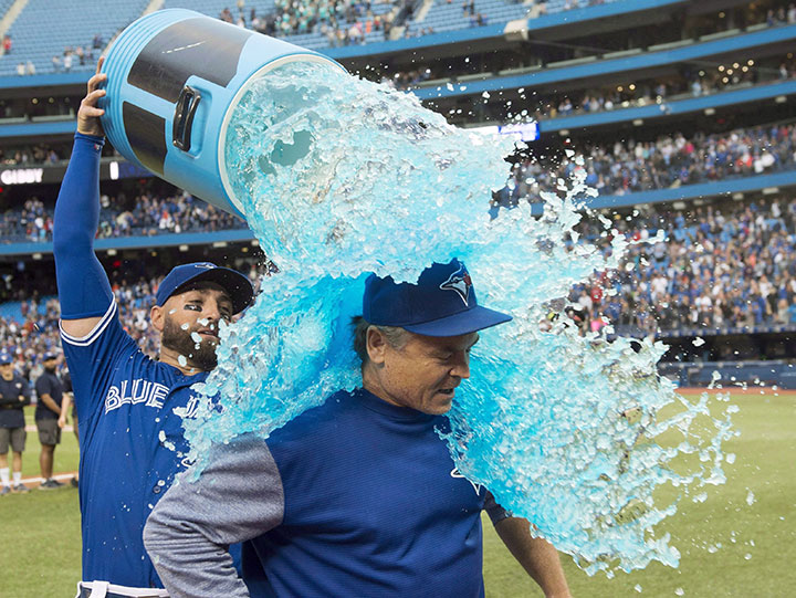 Toronto Blue Jays’ Kevin Pillar pours sports drink over Jays manager John Gibbons after defeating the Houston Astros American league action in Toronto on Wednesday September 26, 2018.
