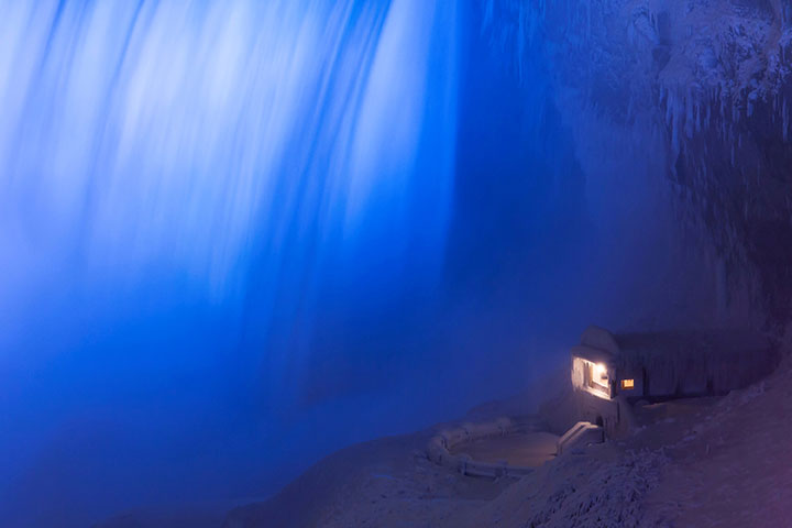A building covered in ice sits at the base of the Horseshoe Falls in Niagara Falls, January 2, 2018.
