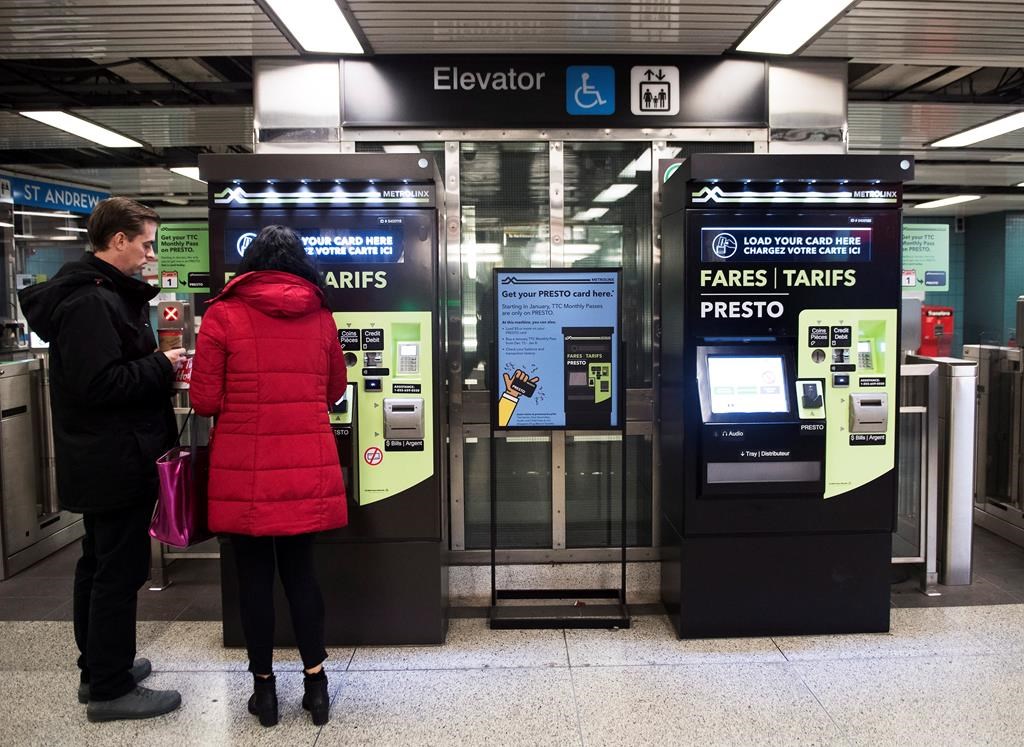 People pay at Presto machines underground in the TTC subway portals in Toronto on Tuesday, December 4, 2018. THE CANADIAN PRESS/Nathan Denette.