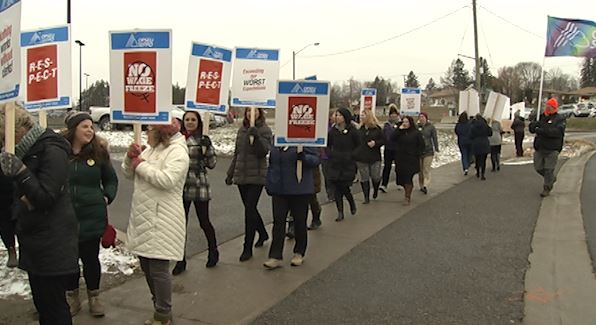 A few hundred union members show support for clerical workers after a wage freeze at PRHC.