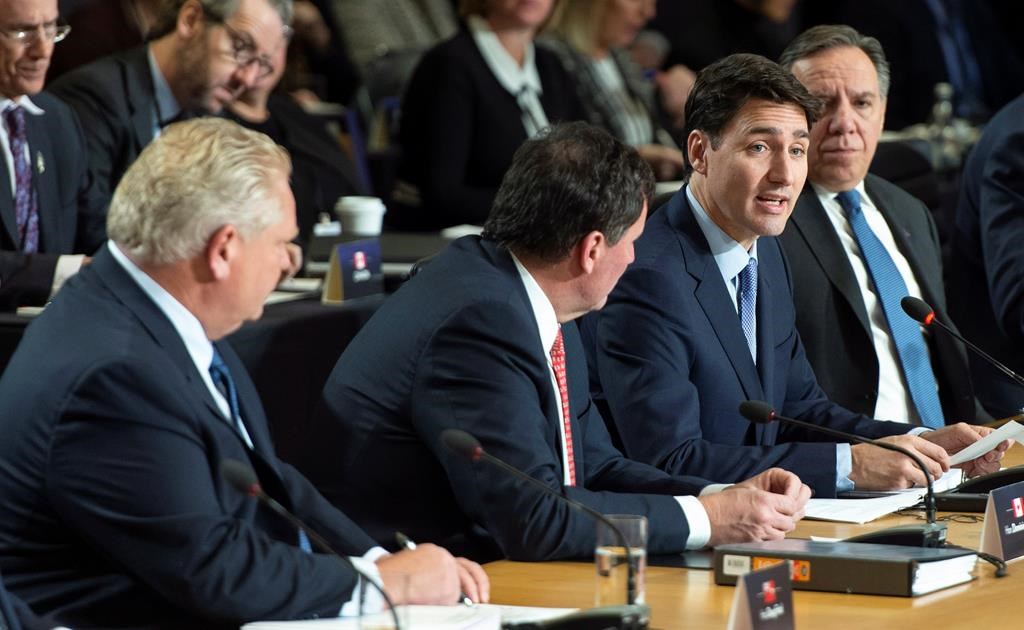 Prime Minister Justin Trudeau addresses the first session of the first ministers meeting flanked by Ontario Premier Doug Ford, intergovernmental Affairs Minister Dominic LeBlanc and Quebec Premier Francois Legault in Montreal on Friday, December 7, 2018.