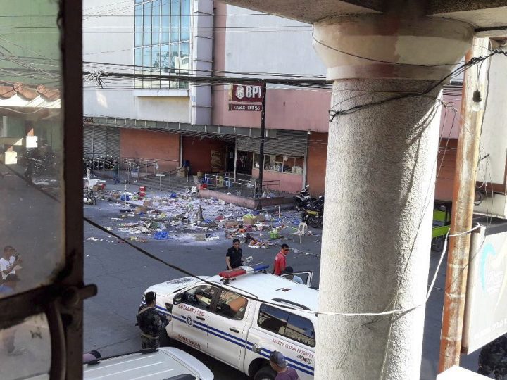 National Police investigators examine the site at the South Seas Mall following an explosion on New Year’s Eve in Cotabato city, southern Philippines Monday, Dec. 31, 2018.