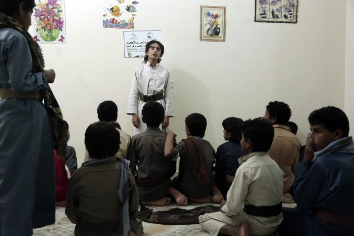 Boys recite poems during a session at a rehabilitation centre for former child soldiers in Marib, Yemen, in this July 25, 2018, photo.