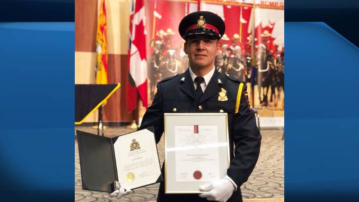 Prince Albert police dog handler Cst. Kelsey Bighetty with awards for the work he’s done with his partner, Daxa.