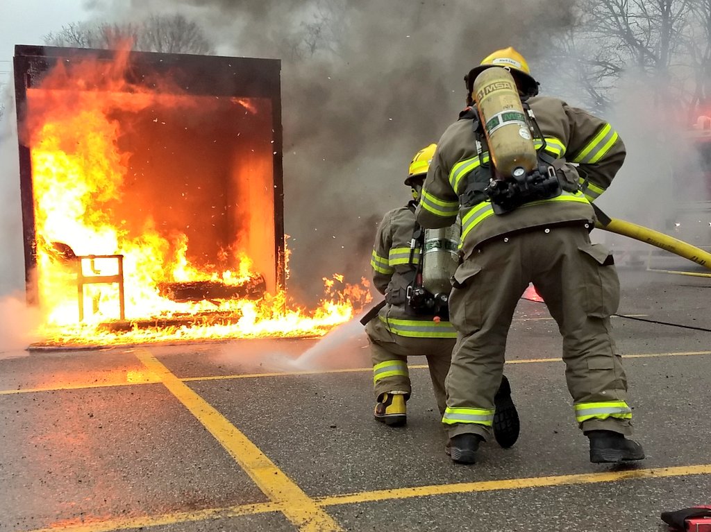 Port Hope firefighters attack controlled burn.