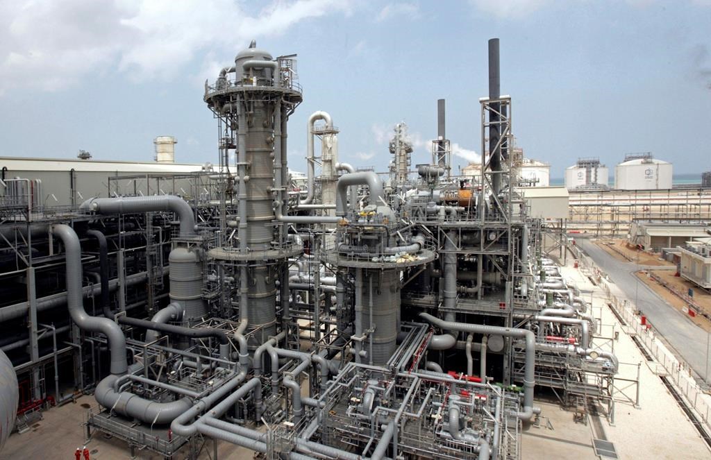 FILE - This April 4, 2009, file photo, shows a gas production facility at Ras Laffan, Qatar. The tiny, energy-rich Arab nation of Qatar announced on Monday, Dec. 3, 2018 it would withdraw from OPEC, mixing its aspirations to increase production outside of the cartel's constraints with the politics of slighting the Saudi-dominated group amid the kingdom's boycott of Doha. (AP Photos/Maneesh Bakshi, File).