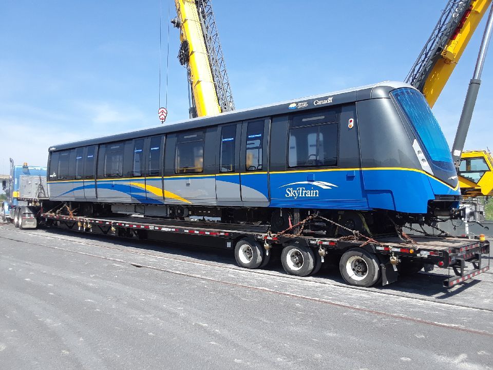 Train one arrives in Burnaby on a flatbed truck.