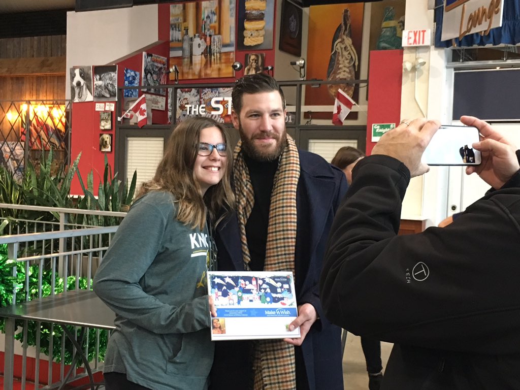 Samantha Pires, 11, poses with former NHL player Brandon Prust for a photo taken by Samantha’s father, Nelson, during the Make-A-Wish Southwestern Ontario wish reveal at Covent Garden Market on Monday, Dec. 17, 2018. Samantha was granted her wish to go on a cruise with her family, thanks to a $10,000 donation to Make-A-Wish Southwestern Ontario from the Brandon Prust Foundation.
