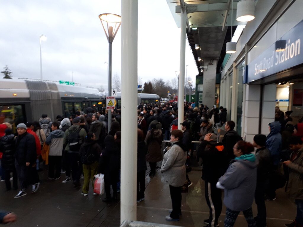 Crowds at Scott Road station due to flooding along the SkyTrain line in New Westminster.