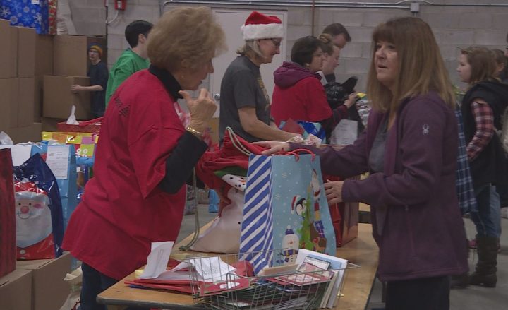 Volunteers sorted Christmas gifts for 5,100 isolated Calgary seniors on Dec. 1. 