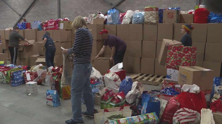 Volunteers sorted Christmas gifts for 5,100 isolated Calgary seniors on Dec. 1.