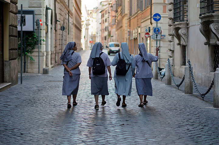 Nuns walk in downtown Rome, Wednesday, Aug. 29, 2018. 