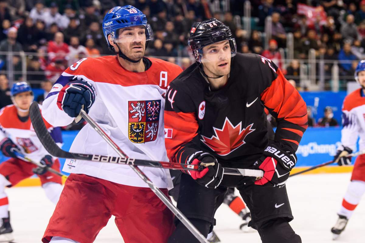 Canada defenceman Stefan Elliott (24) and Czech Republic defenceman Jan Kolar (29) battle for position during second period of the Men's Ice Hockey Preliminary Round Group A game between Olympic Athletes from Czech Republic and Canada during the 2018 Olympic Winter Games at Gangneung Hockey Centre, in Gangneung, South Korea, on February 17, 2018.