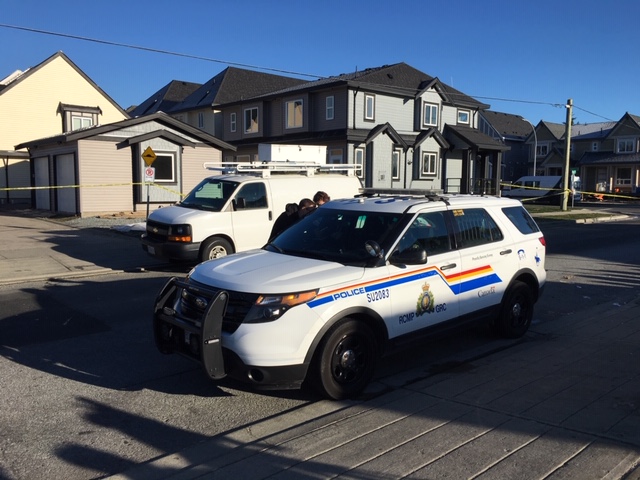 Surrey RCMP outside the home in Newton Friday morning. 