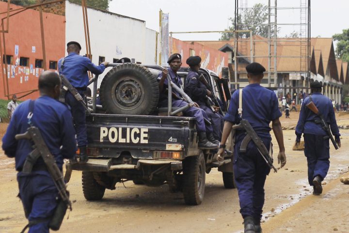 Congolese police move to quell protests in the Eastern Congolese town of Beni, Friday Dec. 28, 2018, as they demonstrate against the election postponed until March 2019.