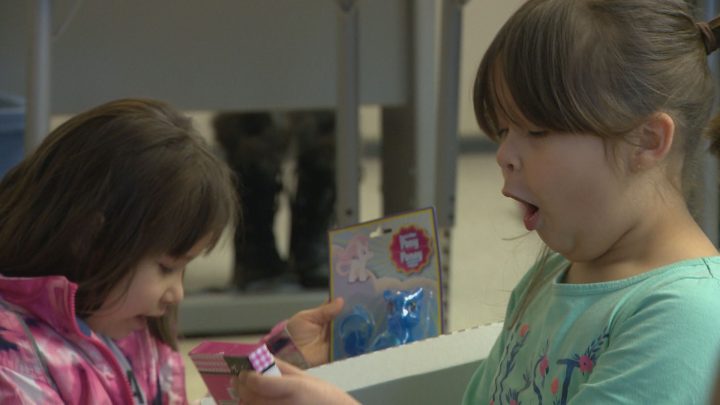Grade 1 student at Princess Alexandra reacts to her gift.