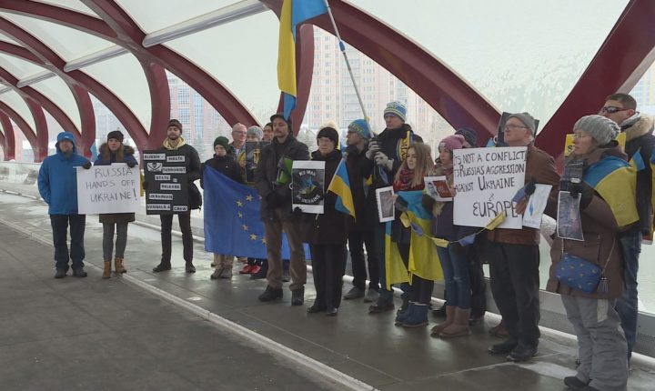 People rallied in support of Ukraine at the Peace Bridge in Calgary on Saturday.