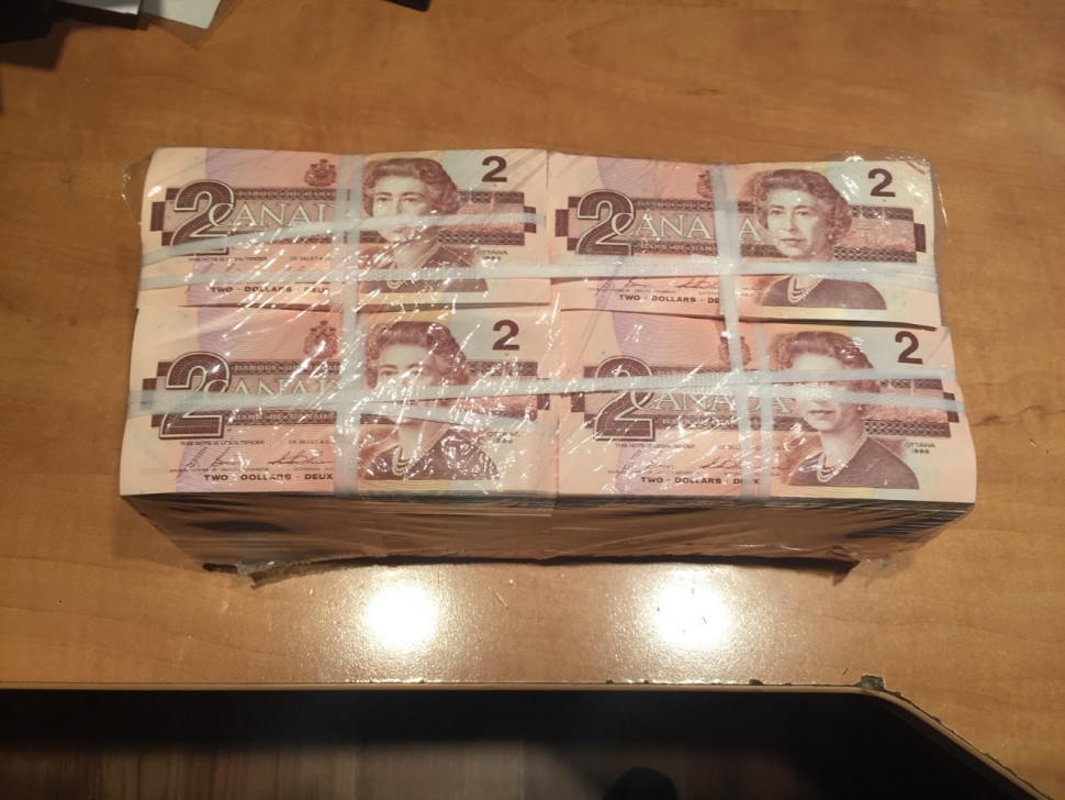 New Brunswick RCMP are warning businesses in Moncton after the theft of a large quantity of $1 and $2 bills. 