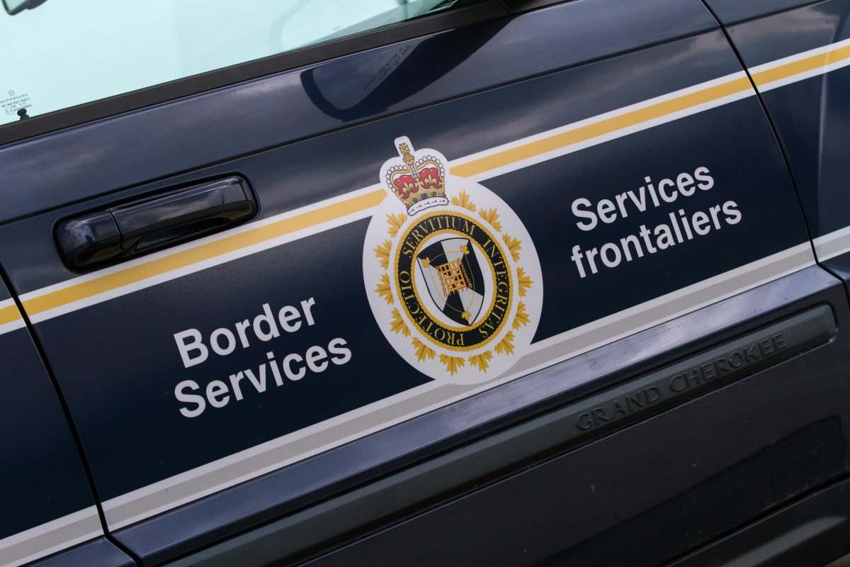 A Belgian man who had applied for and received a work permit in Canada is now detained because he is wanted in his home country on fraud and money laundering charges.