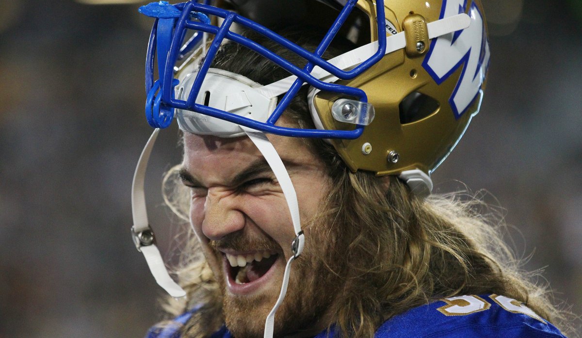 Blue Bombers' John Rush celebrates on the bench during fourth quarter CFL first quarter action in Hamilton on Saturday, August 12th, 2017.  (CFL PHOTO - Dave Chidley).