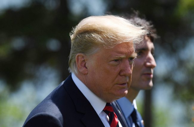 U.S. President Donald Trump and Canada's Prime Minister Justin Trudeau leave the Welcome Ceremony at the G7 summit in Charlevoix, Que., June 8, 2018.
