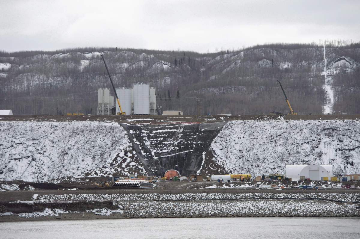 The Site C Dam location is seen along the Peace River in Fort St. John, B.C., on April 18, 2017. British Columbia's mammoth Site C hydro-electric project is seriously behind schedule, plagued by quality problems and marked by secrecy, says an assessment by an international dam expert. THE CANADIAN PRESS/Jonathan Hayward.