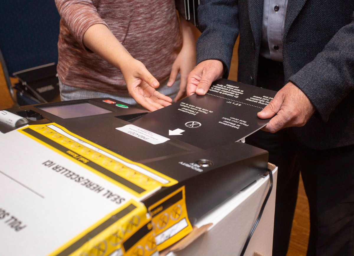 New Brunswick residents cast their votes in Fredericton, N.B., on Monday, Sept. 24, 2018. 