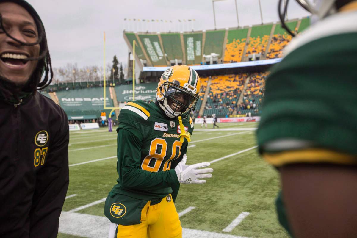 Edmonton Eskimos' Bryant Mitchell (80) celebrates his 75-yard touchdown with Derel Walker (87) during second half CFL action against the Ottawa Redblacks, in Edmonton on Saturday, Oct. 13, 2018. 