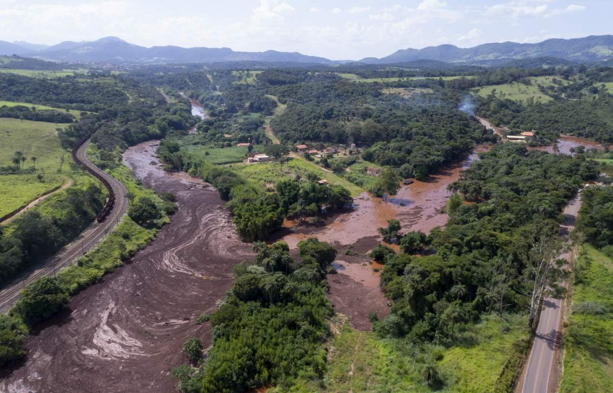 An aerial view shows flooding triggered by a dam collapse near Brumadinho, Brazil, Friday, Jan. 25, 2019.