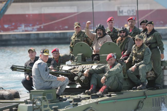 Venezuela’s President Nicolas Maduro and his wife Cilia Flores are seen atop a military vehicle during a military exercise in Puerto Cabello, Venezuela Jan. 27, 2019.