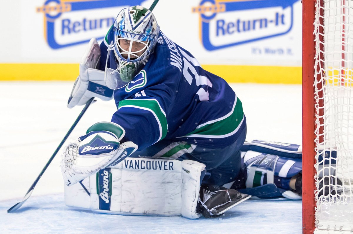 Vancouver Canucks goalie Anders Nilsson, of Sweden, reaches for a shot that went wide of the goal on Tuesday December 4, 2018. The Ottawa Senators acquired Nilsson in a trade with the Vancouver Canucks on Wednesday.