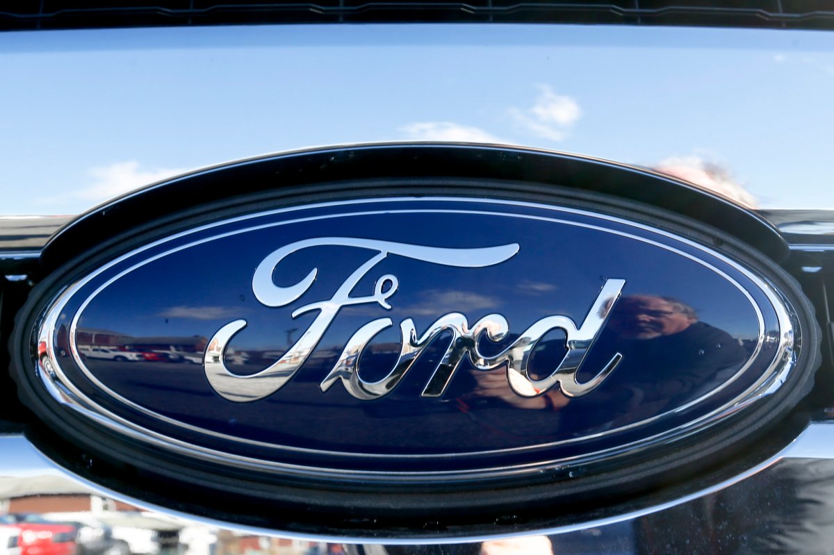 This Nov. 19, 2015 file photo shows the blue Ford oval badge in the grill of a pickup truck on the sales lot at Butler County Ford in Butler, Pa. 
