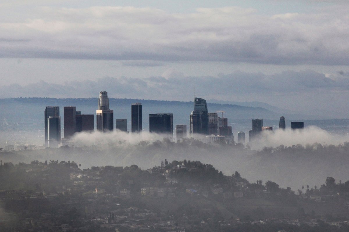 High-rises of downtown Los Angeles rise above clouds and mist on Sunday, Jan. 6, 2019, after an overnight storm that brought rain and mountain snow to Southern California.