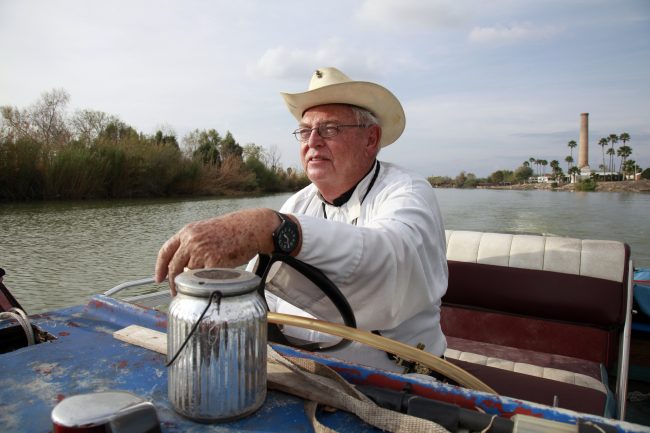 In this Tuesday, Jan. 8, 2019 photo, father Roy Snipes, pastor of the La Lomita Chapel, shows Associated Press journalists the land on either side of the Rio Grande at the US-Mexico border in Mission, Texas.