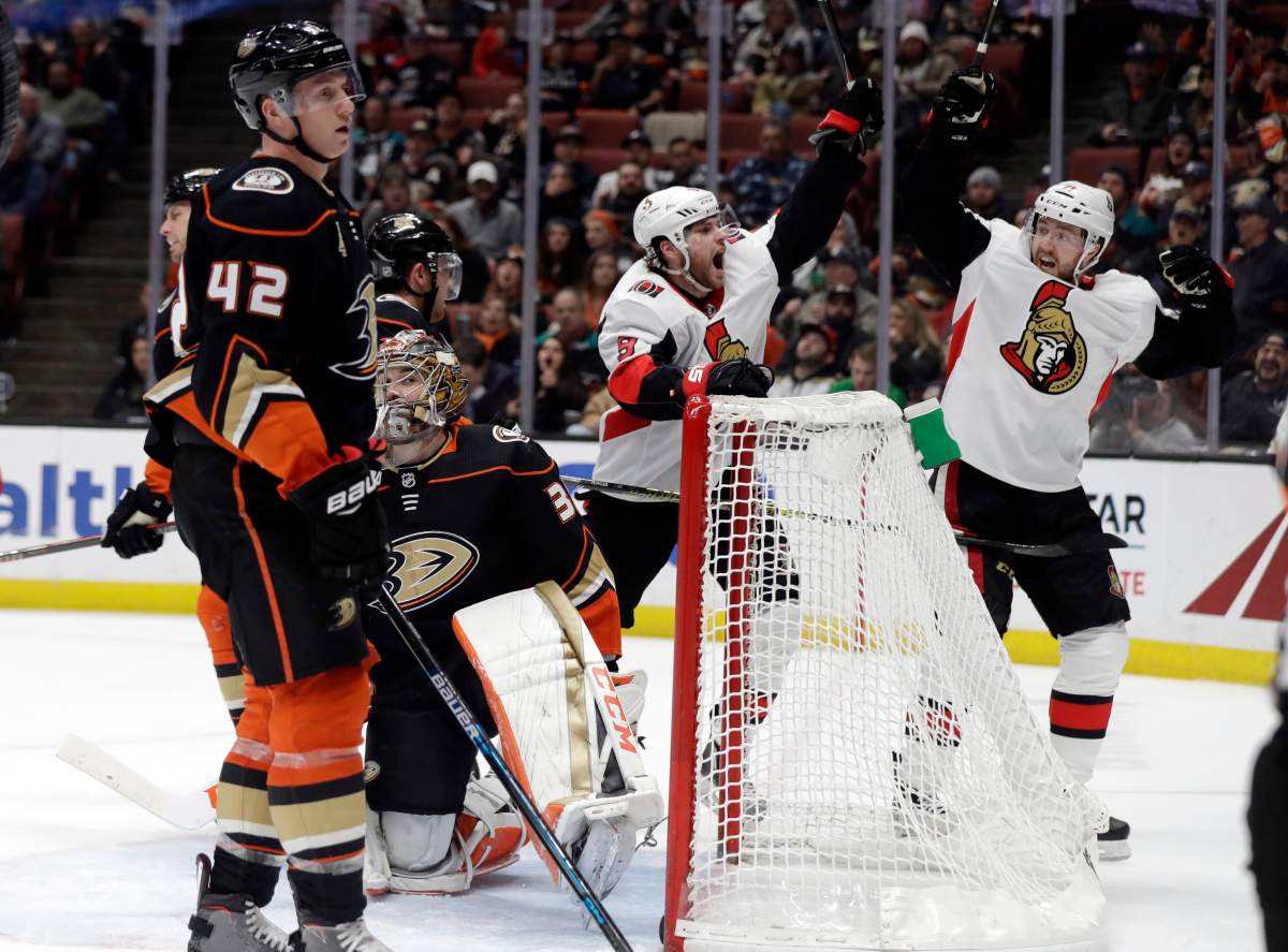 Ottawa Senators' Bobby Ryan, center, celebrates his goal with teammate Chris Tierney, right, during the third period of an NHL hockey game against the Anaheim Ducks Wednesday, Jan. 9, 2019, in Anaheim, Calif. 