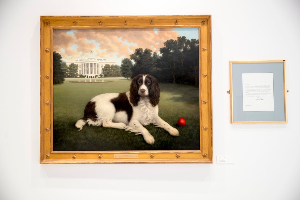 This Wednesday, Jan. 9, 2019, photo shows "Millie on the South Lawn" by Christine Merrill, alongside a letter from former first lady Barbara Bush on display at the American Kennel Club Museum of the Dog in New York.