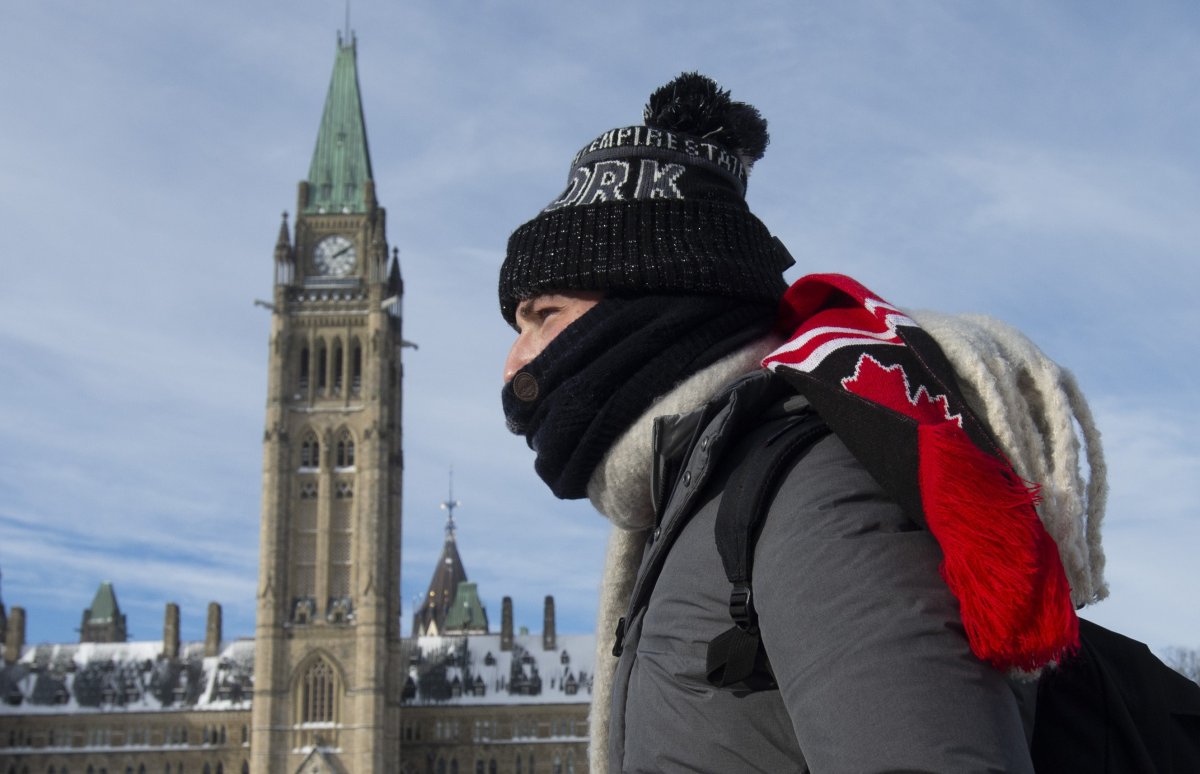 A tourist makes his way onto Parliament Hill Monday January 21, 2019 in Ottawa. Cold weather continued to affect the region with cold temperatures and windchill warnings in effect.