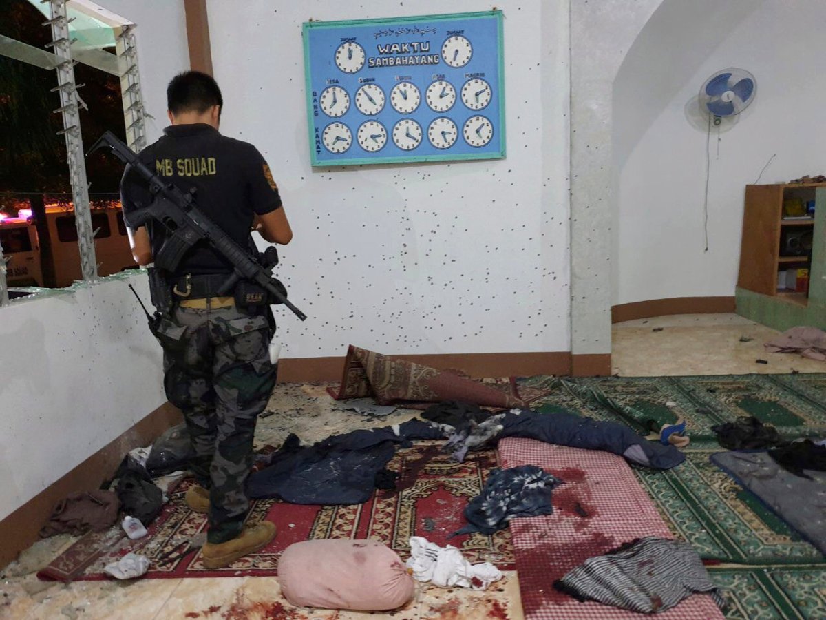 A police investigator examines the scene of a grenade attack on a Muslim mosque in Zamboanga city in southern Philippines, Jan. 30, 2019. 



