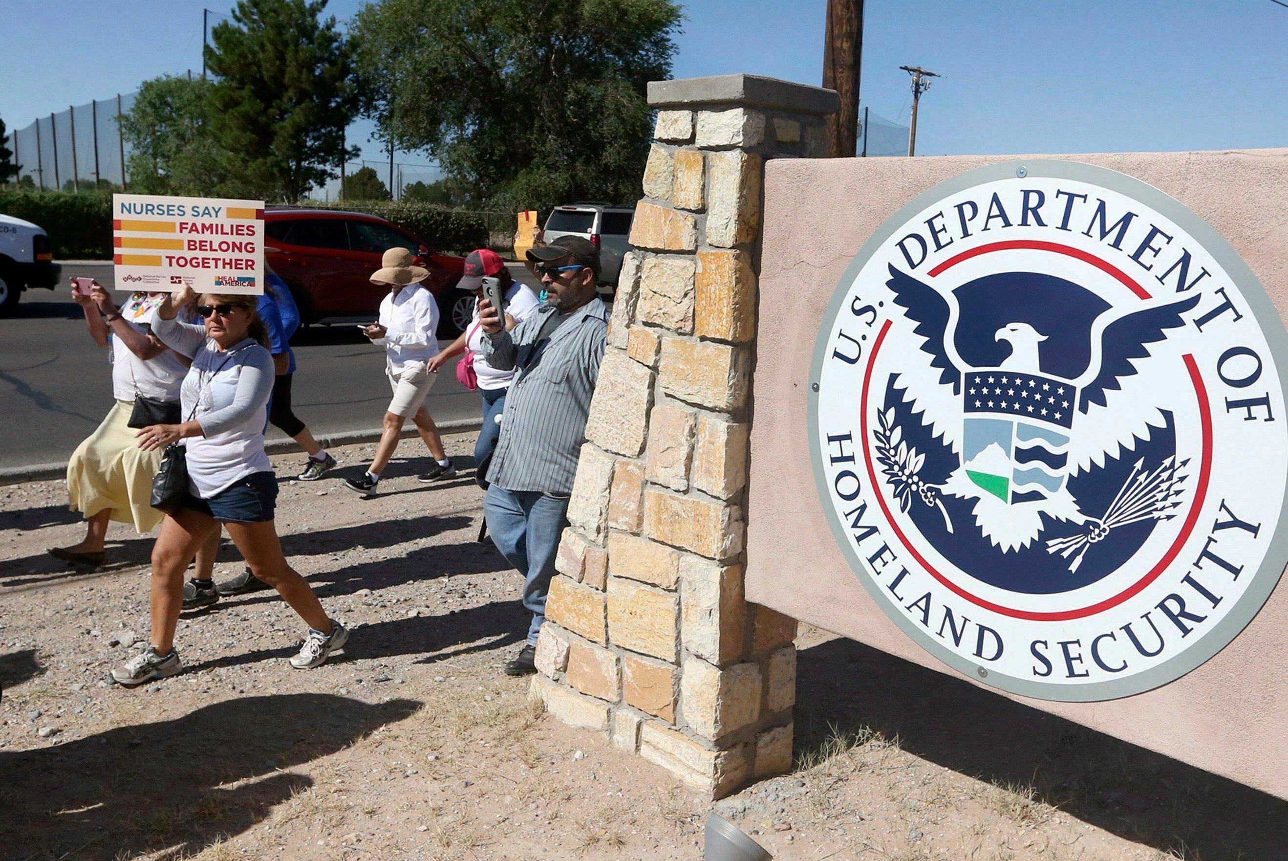 This June 2018 photo shows protesters walking along Montana Avenue outside the El Paso Processing Center, in El Paso, Texas. Federal immigration officials are force feeding some of the immigrants who have been on hunger strike for nearly a month inside the Texas detention facility, The Associated Press has learned.