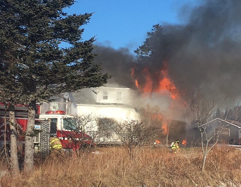 Officials have closed part of Highway 7 as they respond to an ongoing structure fire in Spry Harbour. 