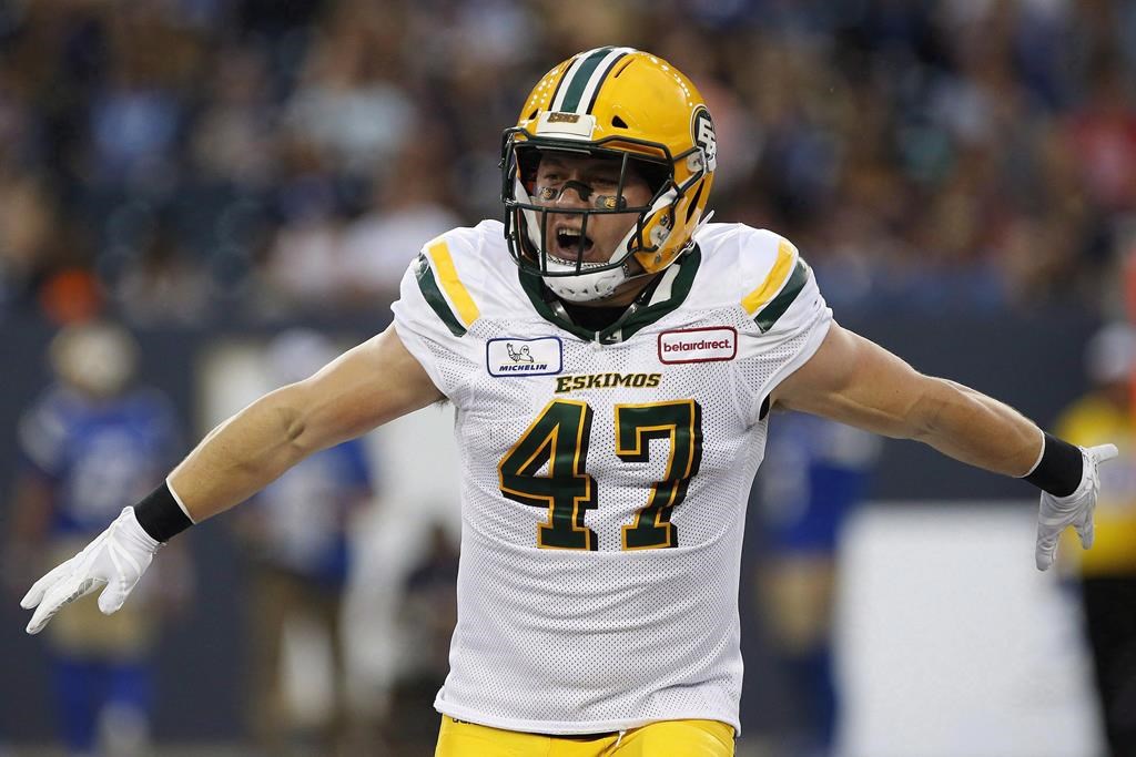 Edmonton Eskimos' JC Sherritt (47) celebrates his fumble recovery against the Winnipeg Blue Bombers during the first half of CFL action in Winnipeg on June 14, 2018.