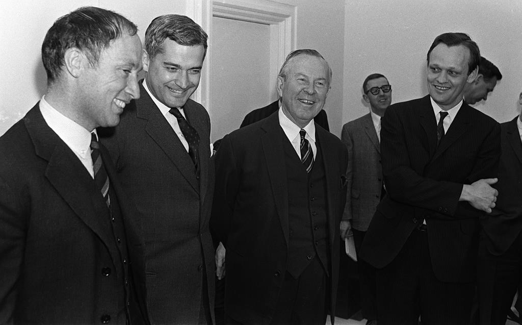 Prime Minister Lester B. Pearson (second right) and cabinet ministers Pierre Trudeau (left to right) John Turner, and Jean Chretien talk in Ottawa on April 4, 1967.