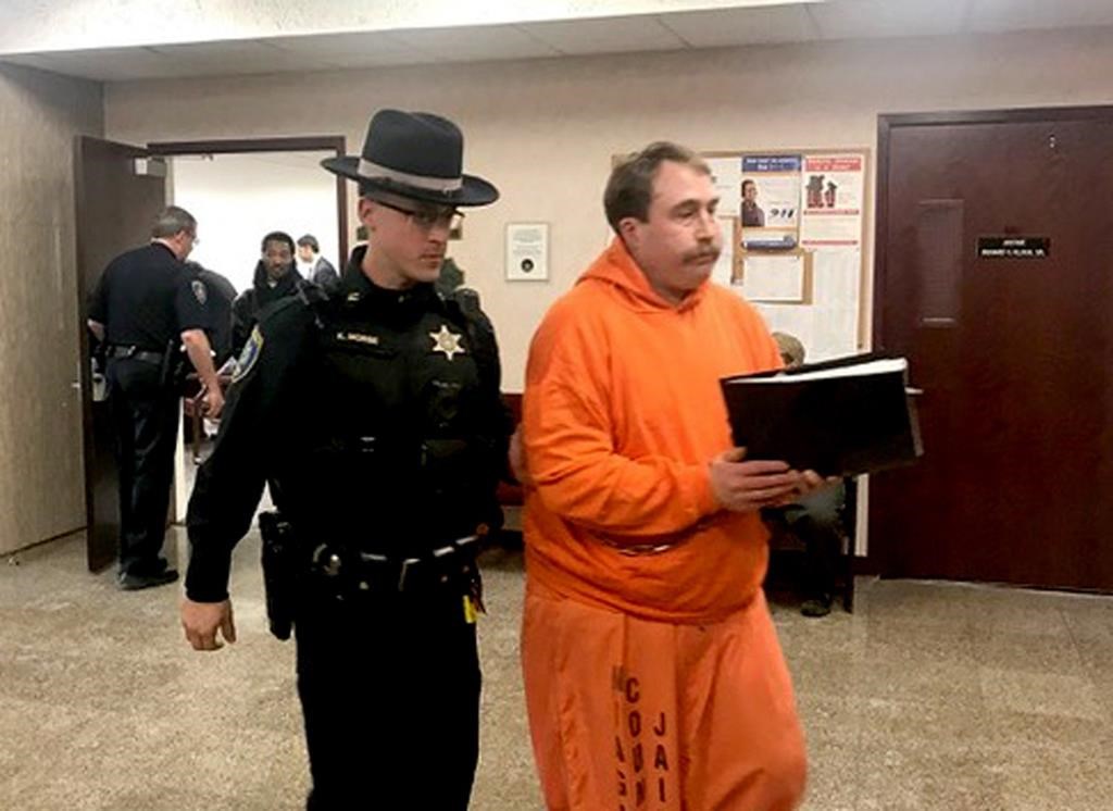 A law enforcement officer leads William Shrubsall through the Niagara County Court House in Lockport, N.Y., on Tuesday, Jan. 22, 2019.