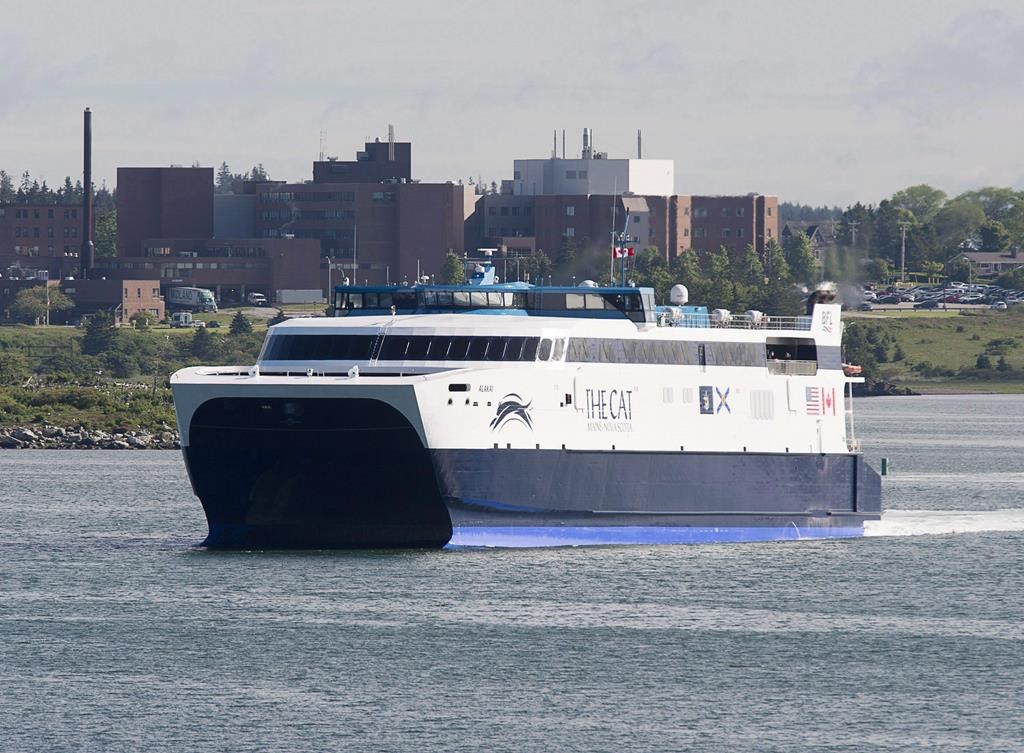 The CAT, a high-speed passenger ferry, departs Yarmouth, N.S. heading to Portland, Maine, on its first scheduled trip on June 15, 2016. The private operator of the Nova Scotia-Maine ferry says its move to a new port in the state is being held up by the U.S. government shutdown and the transition to a new governor. THE CANADIAN PRESS/Andrew Vaughan.