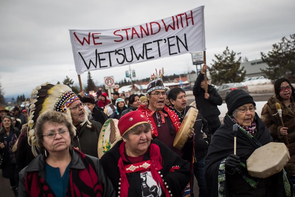 Hereditary Chief Ronnie West, centre, from the Lake Babine First Nation, sings and beats a drum during a solidarity march after Indigenous nations and supporters gathered for a meeting to show support for the Wet'suwet'en Nation, in Smithers, B.C., on January 16, 2019.