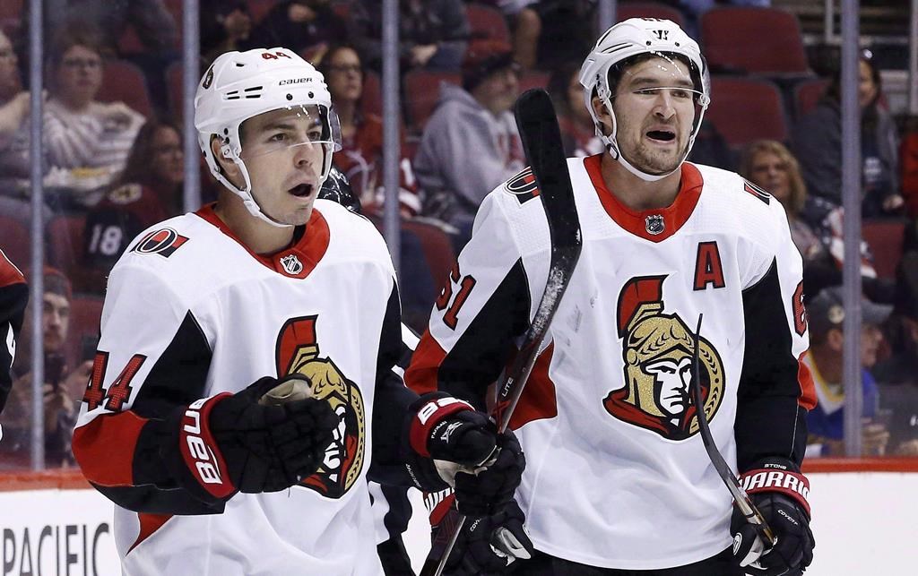 Ottawa Senators centre Jean-Gabriel Pageau (44) celebrates his goal against the Arizona Coyotes with right winger Mark Stone (61) during the first period of an NHL hockey game Saturday, March 3, 2018, in Glendale, Ariz. Pageau is expected to make his season debut on Sunday against the Carolina Hurricanes after missing the first 41 games with a torn Achilles tendon. THE CANADIAN PRESS/AP/Ross D. Franklin.