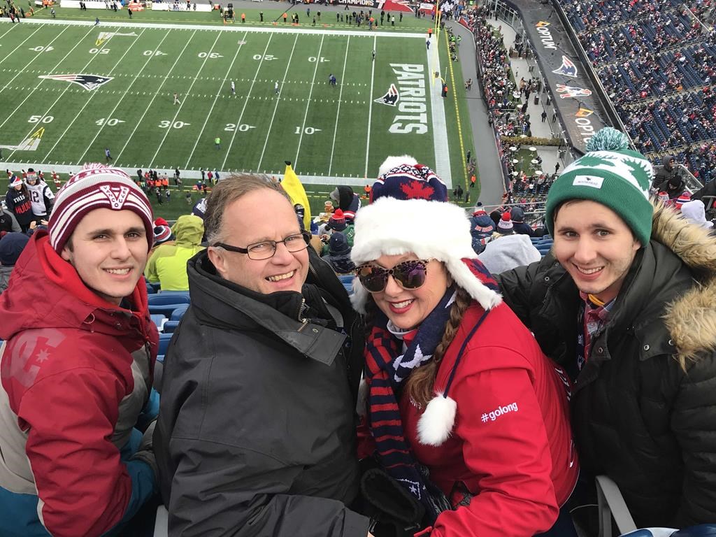 Wayne Long, Member of Parliament for Saint John - Rothesay, poses with his wife and two sons at a New England Patriots game in Foxborough, Mass., in this undated handout photo.